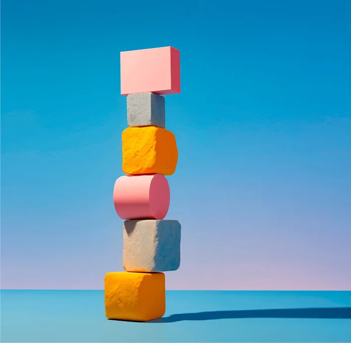 Stack of colourful blocks balanced against a blue background: well-structured training